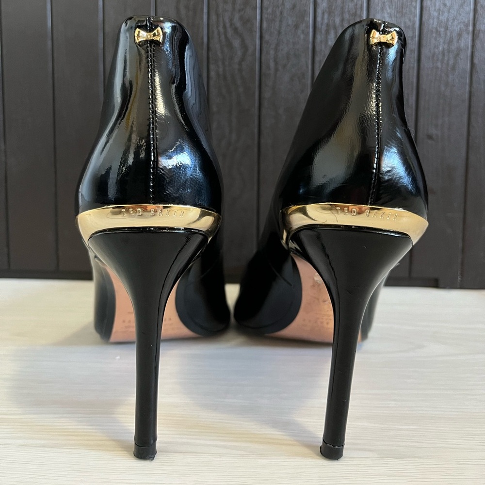 Ted baker black & gold heels with cute gold bow on the back stiletto